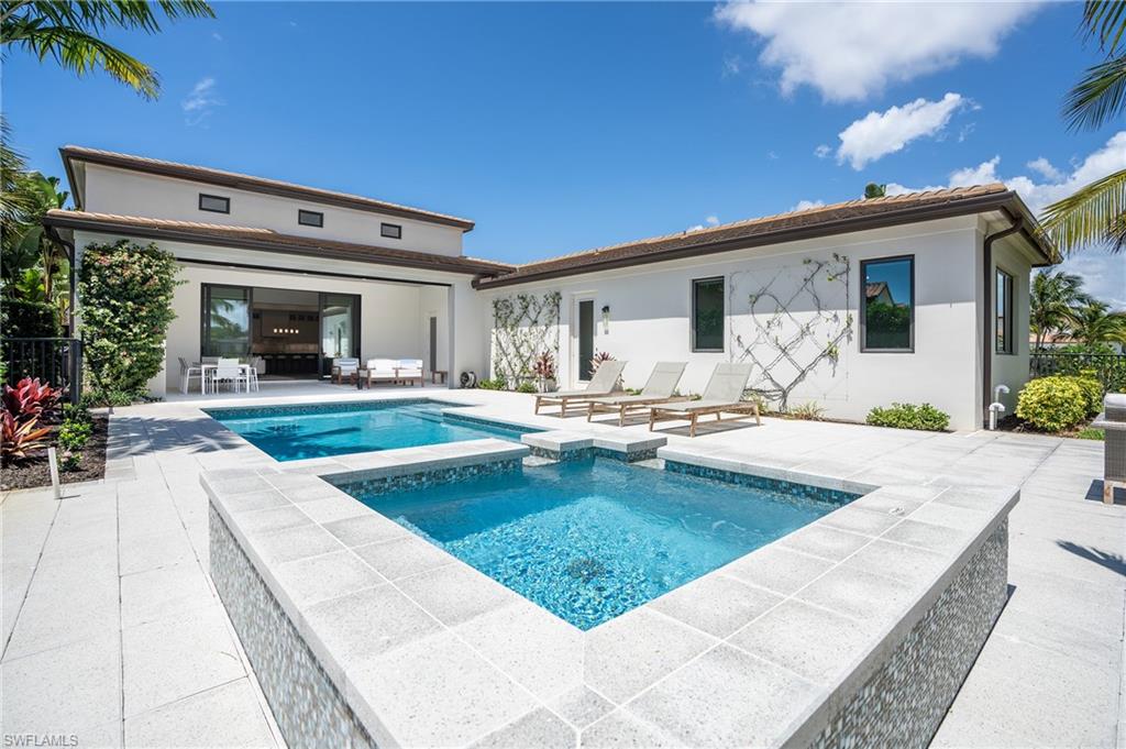 16708 Lucarno Way Naples, FL 34110 - Photo 20 of 46 a view of a house with swimming pool and sitting area