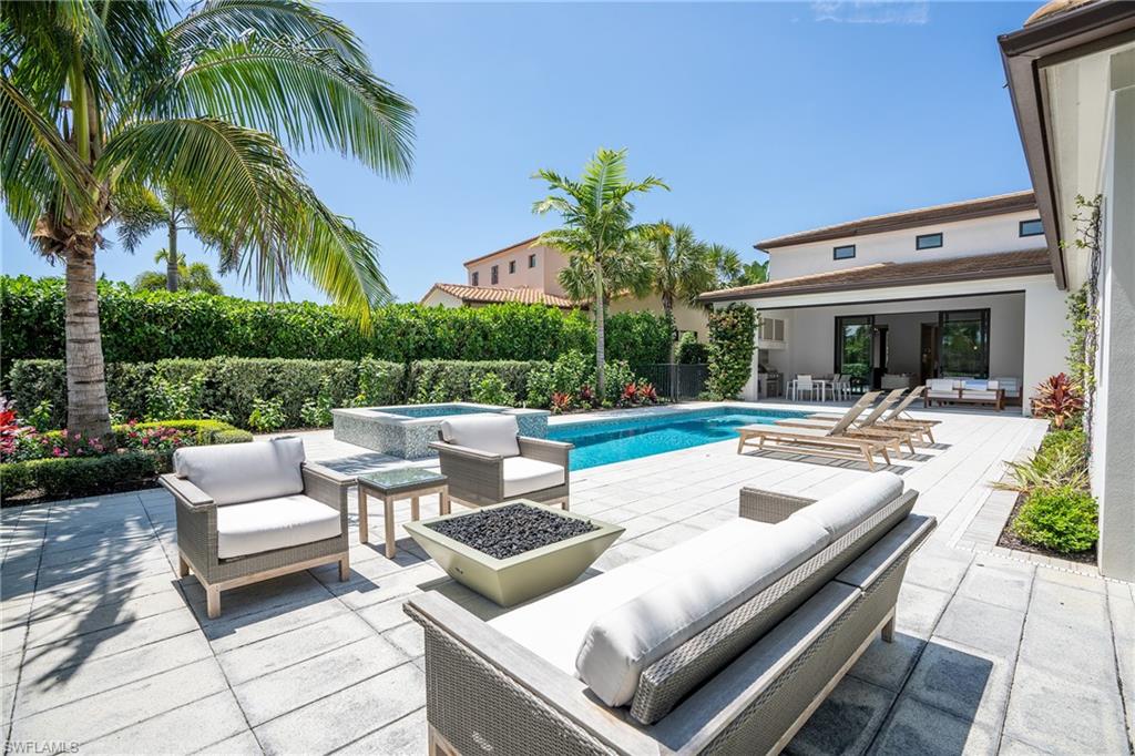 16708 Lucarno Way Naples, FL 34110 - Photo 22 of 46 a view of a patio with couches and a fire pit