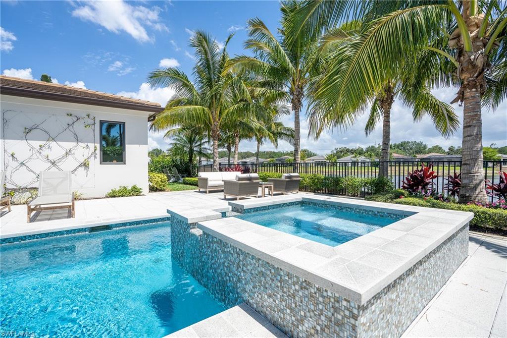 16708 Lucarno Way Naples, FL 34110 - Photo 24 of 46 a view of a backyard with swimming pool