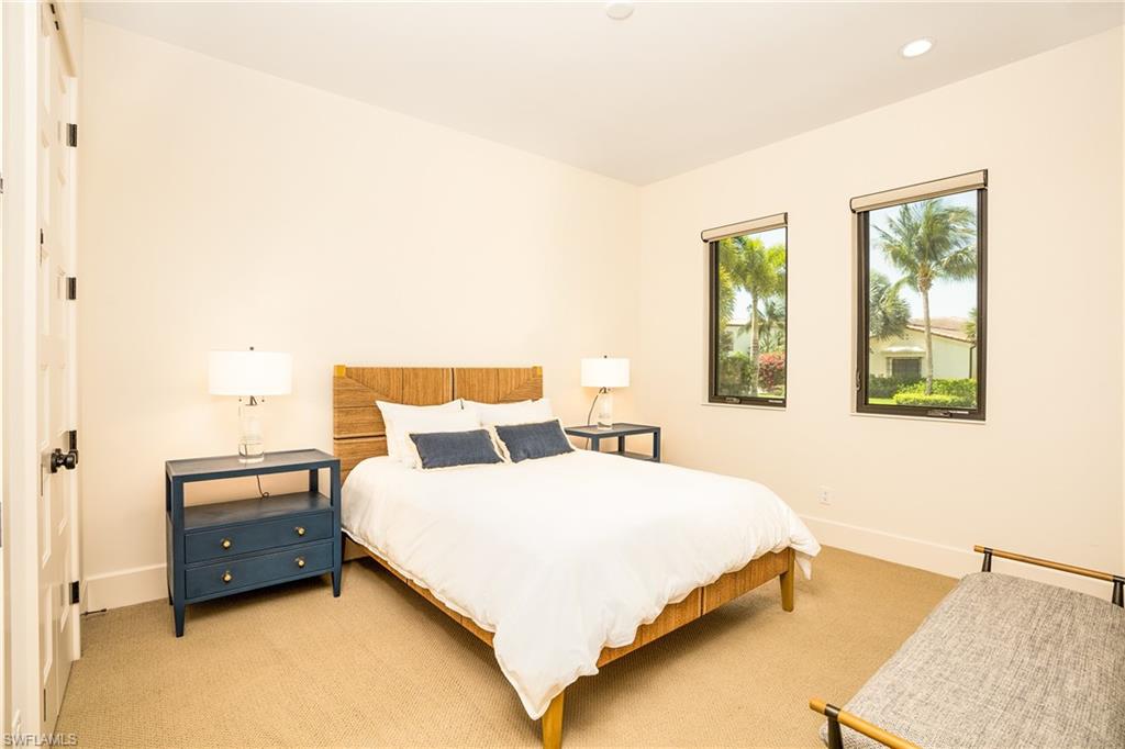 16708 Lucarno Way Naples, FL 34110 - Photo 40 of 46 a bedroom with a bed and window