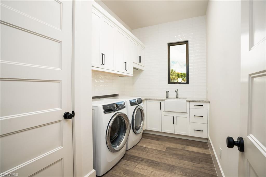 16708 Lucarno Way Naples, FL 34110 - Photo 42 of 46 a view of a hallway with washer and dryer