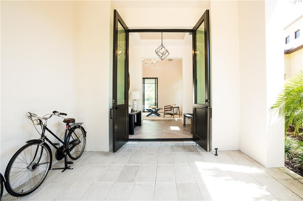 16708 Lucarno Way Naples, FL 34110 - Photo 7 of 46 a view of a room with gym equipment