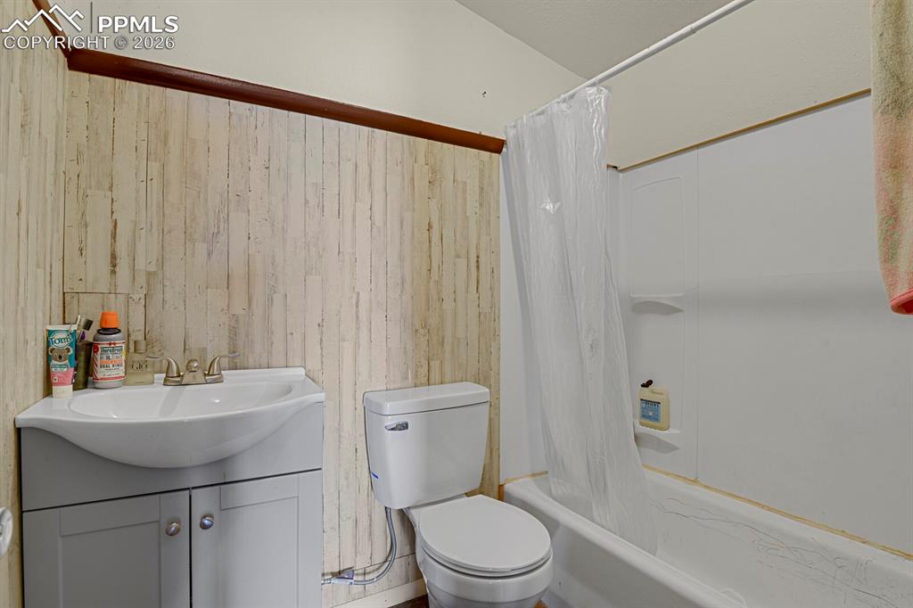 30203 Sanborn Road Yoder, CO 80864 - Photo 12 of 38 a bathroom with a sink a toilet and shower