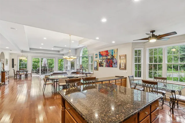 a dining room with furniture window and wooden floor