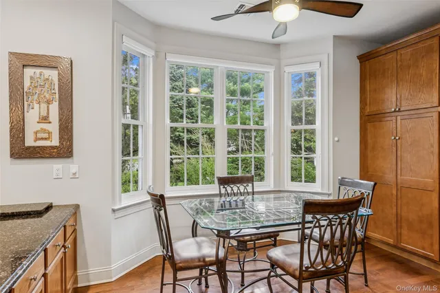 a dining room with furniture and window
