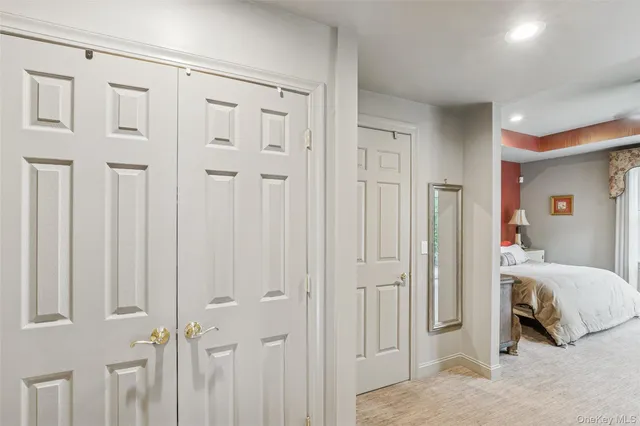 a room that has a bed and a table chair