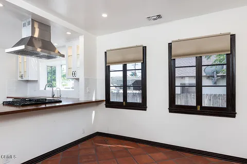 a view of a room with large windows