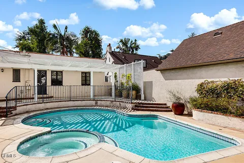 a house view with a garden space