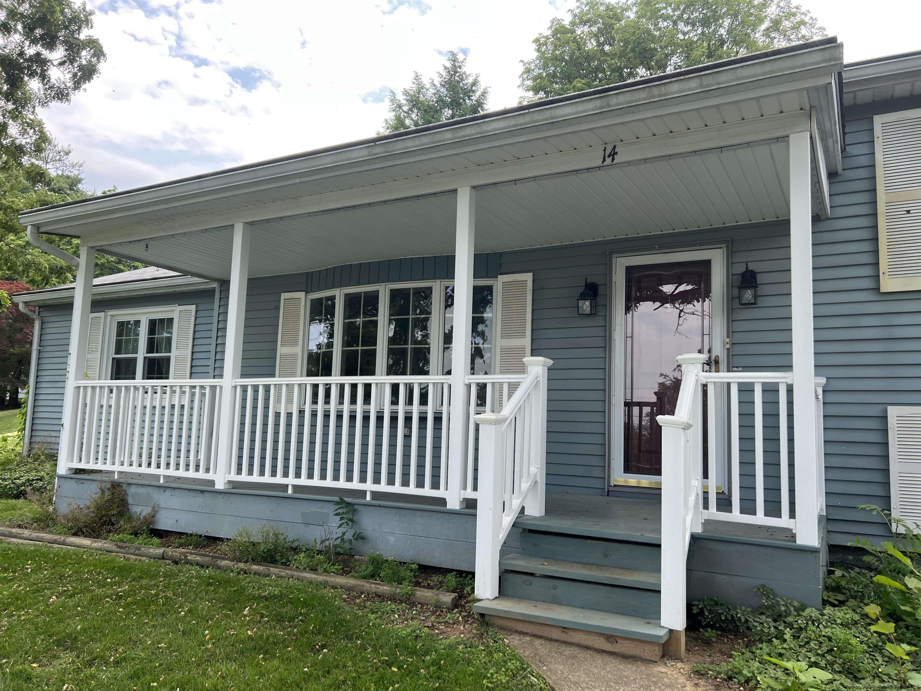 14 Brian Road Poughkeepsie, NY 12601 - Photo 3 of 20 a view of a house with porch and wooden floor