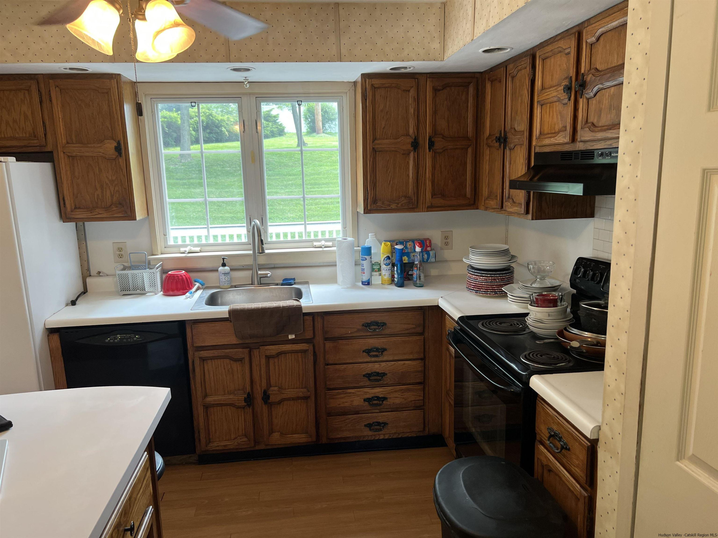 14 Brian Road Poughkeepsie, NY 12601 - Photo 9 of 20 a kitchen with stainless steel appliances a sink stove and cabinets