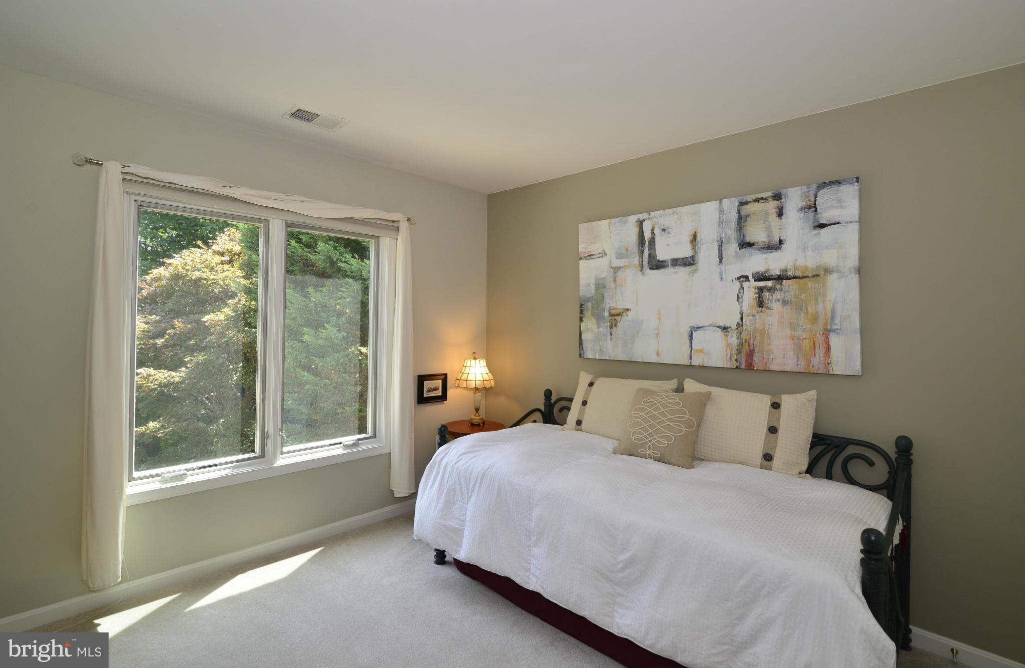 2015 Beacon Place Reston, VA 20191 - Photo 21 of 22 a bedroom with a large bed and a window