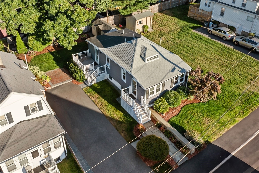 46 Gannett Road Quincy, MA 02169 - Photo 1 of 26 an aerial view of a house with a garden