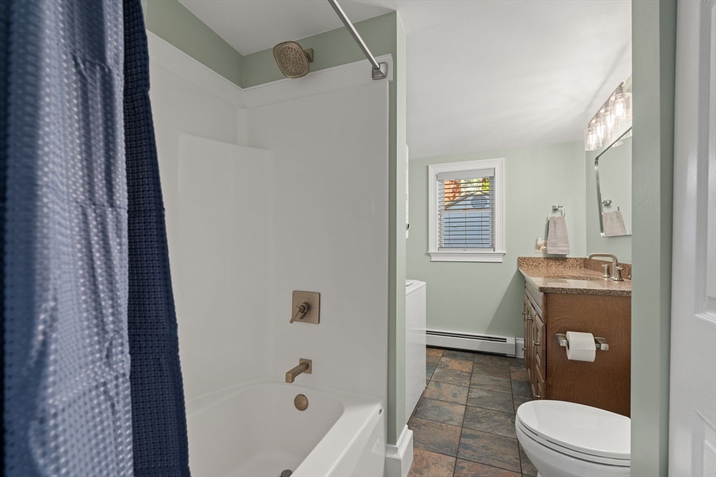 46 Gannett Road Quincy, MA 02169 - Photo 13 of 26 a bathroom with a granite countertop sink toilet and shower