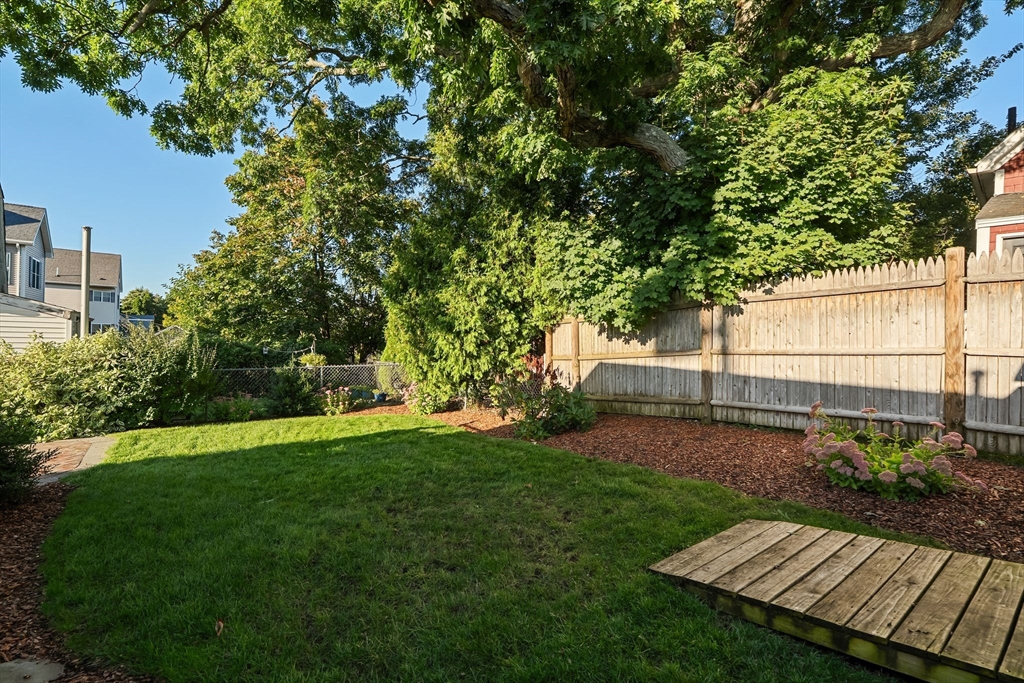 46 Gannett Road Quincy, MA 02169 - Photo 25 of 26 a view of a backyard with wooden fence