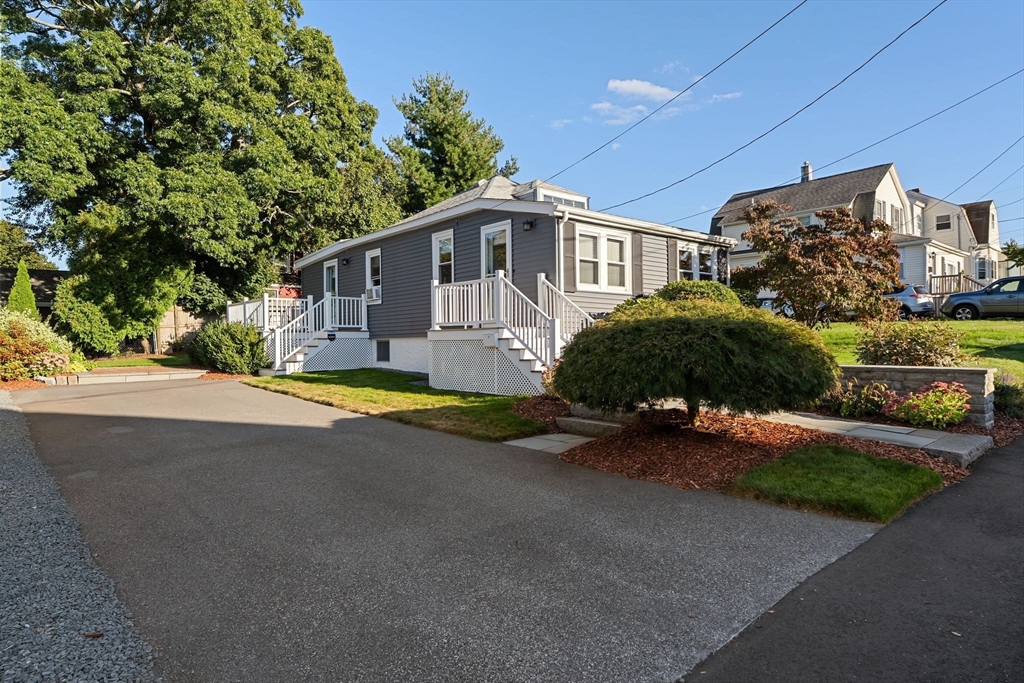 46 Gannett Road Quincy, MA 02169 - Photo 3 of 26 a view of a house with backyard and garden