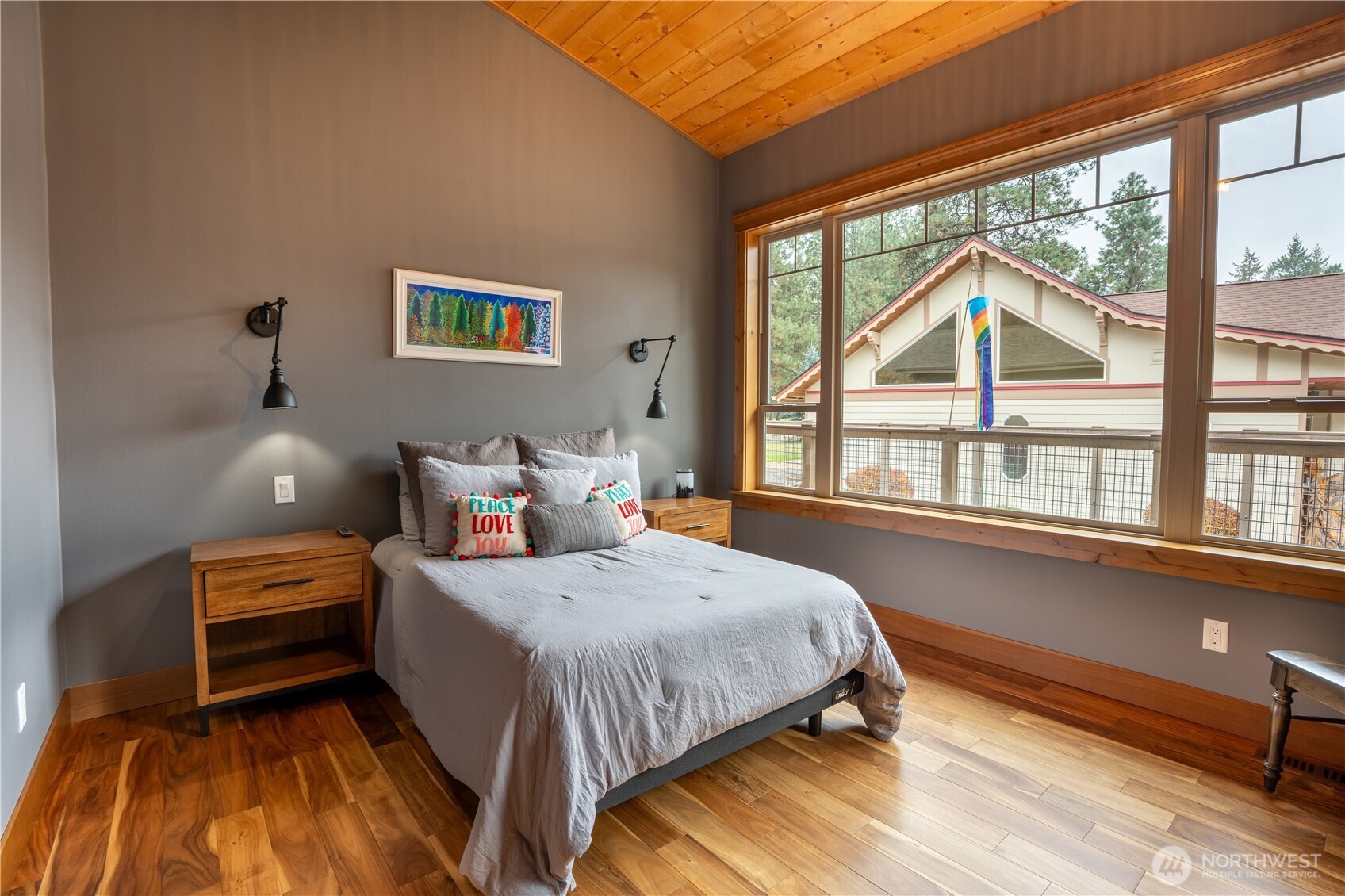 9047 Icicle Road Leavenworth, WA 98826 - Photo 15 of 30 a bedroom with a bed and a large window