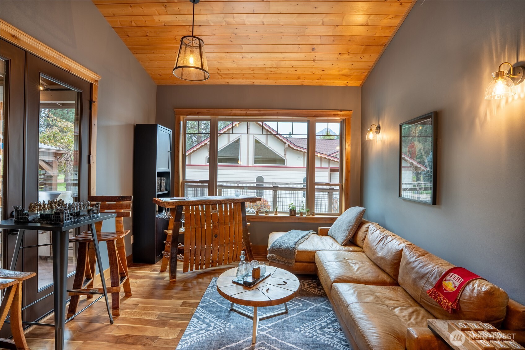 9047 Icicle Road Leavenworth, WA 98826 - Photo 18 of 30 a living room with furniture and floor to ceiling windows