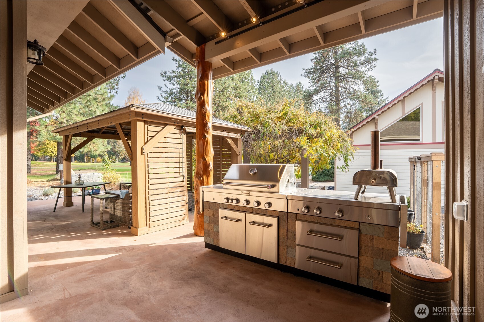 9047 Icicle Road Leavenworth, WA 98826 - Photo 22 of 30 a kitchen with a stove and a wooden floors