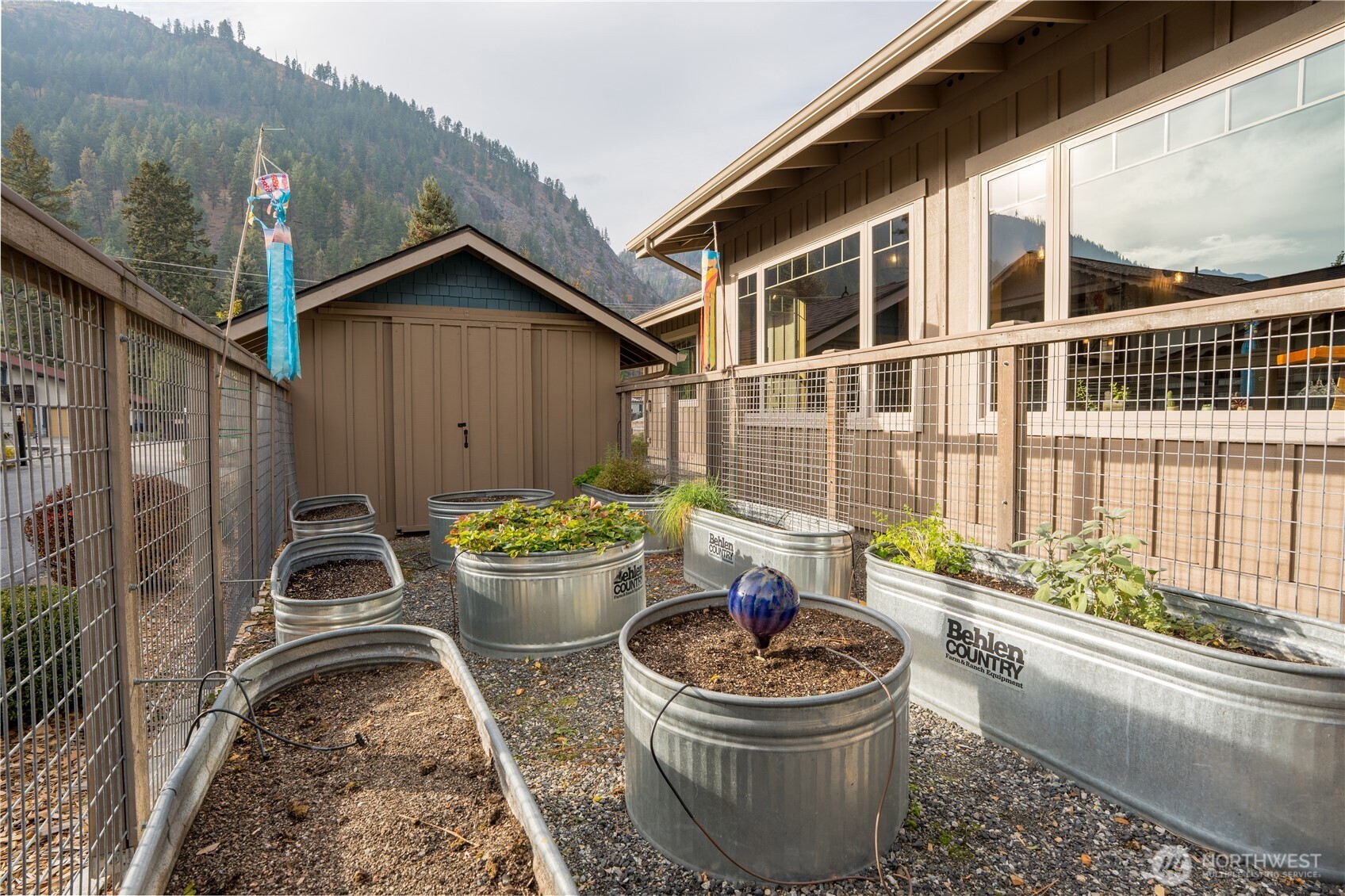 9047 Icicle Road Leavenworth, WA 98826 - Photo 24 of 30 a front view of a house with a garden and patio