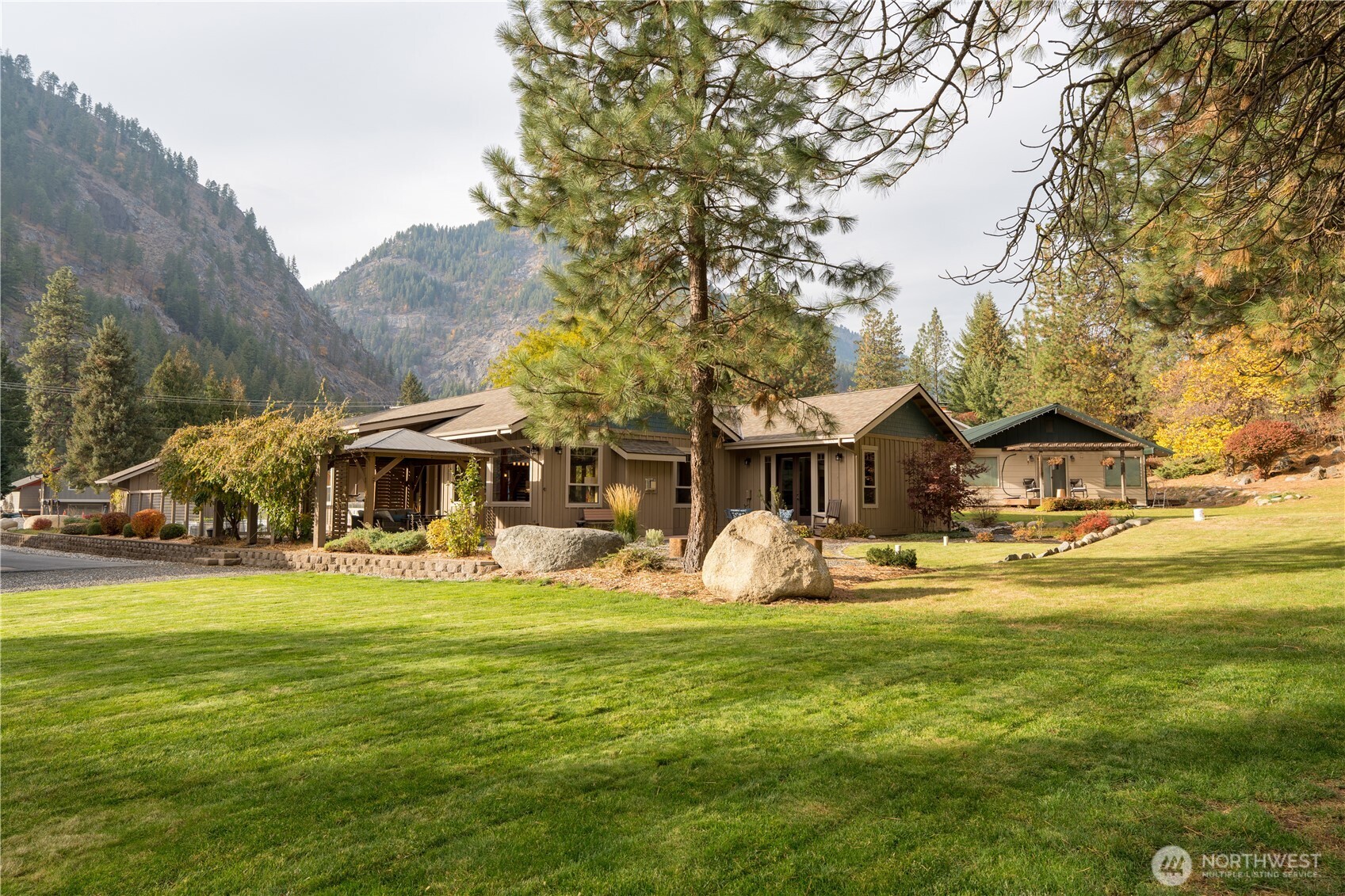 9047 Icicle Road Leavenworth, WA 98826 - Photo 26 of 30 a view of a house with a yard porch and sitting area