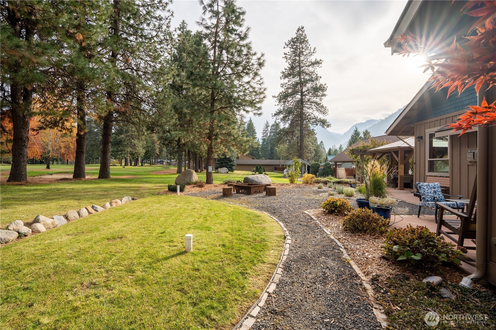 9047 Icicle Road Leavenworth, WA 98826 - Photo 27 of 30 a swimming pool with outdoor seating and yard