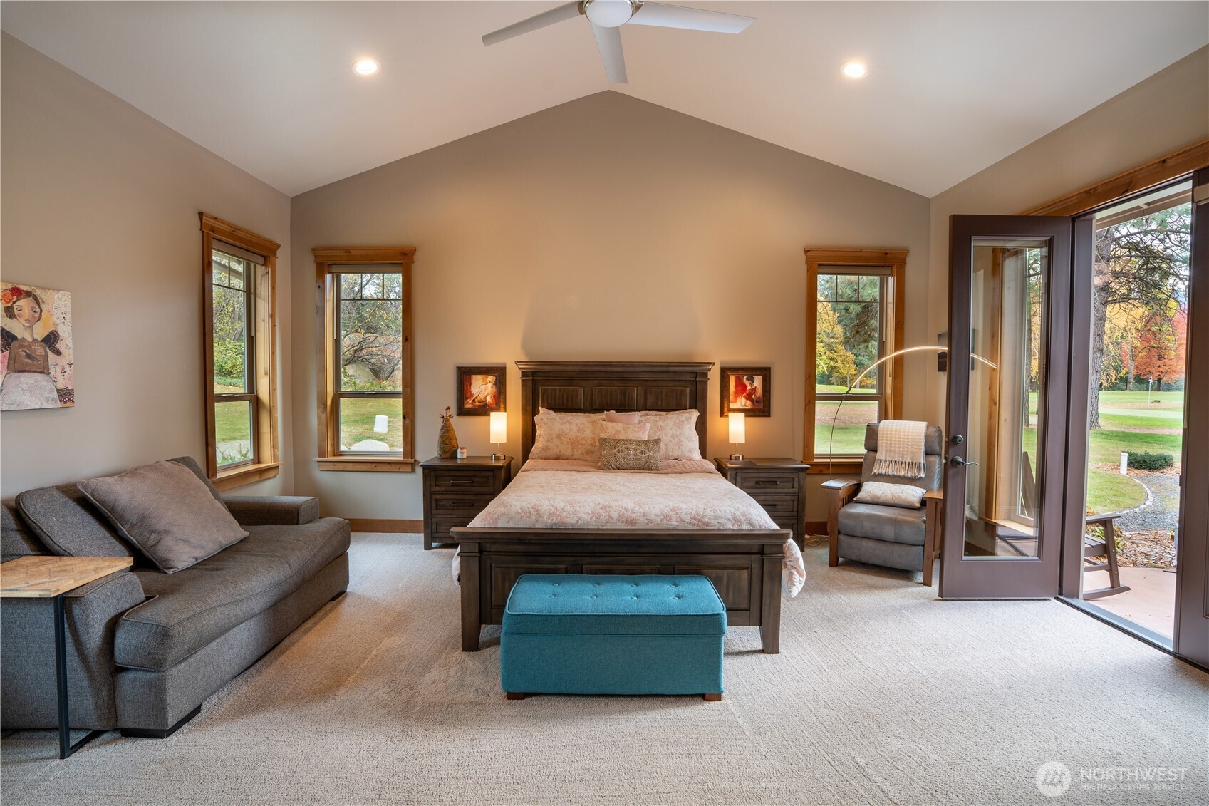 9047 Icicle Road Leavenworth, WA 98826 - Photo 8 of 30 a bedroom with furniture and large windows