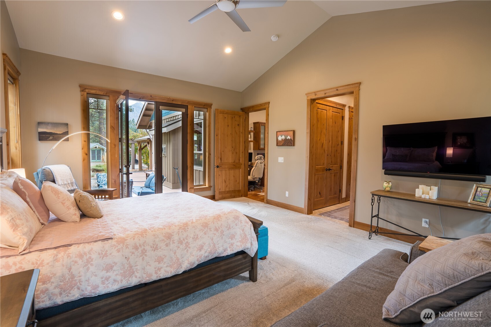 9047 Icicle Road Leavenworth, WA 98826 - Photo 9 of 30 a bedroom with a bed and a flat screen tv