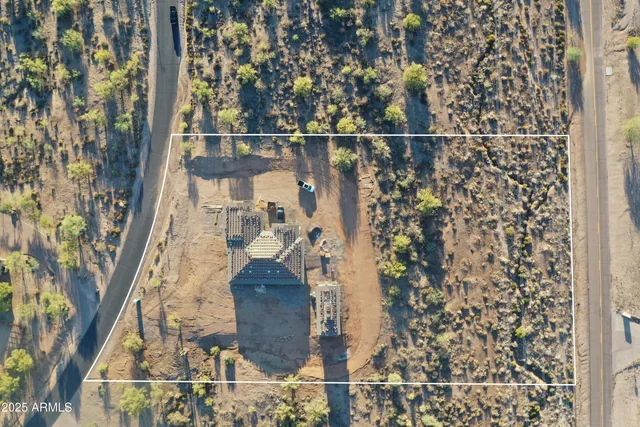 an aerial view of a house with a ocean view