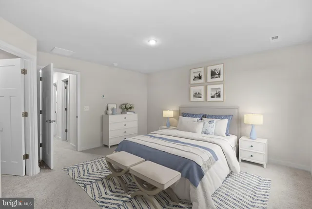 a bedroom with a bed and a view of bathroom