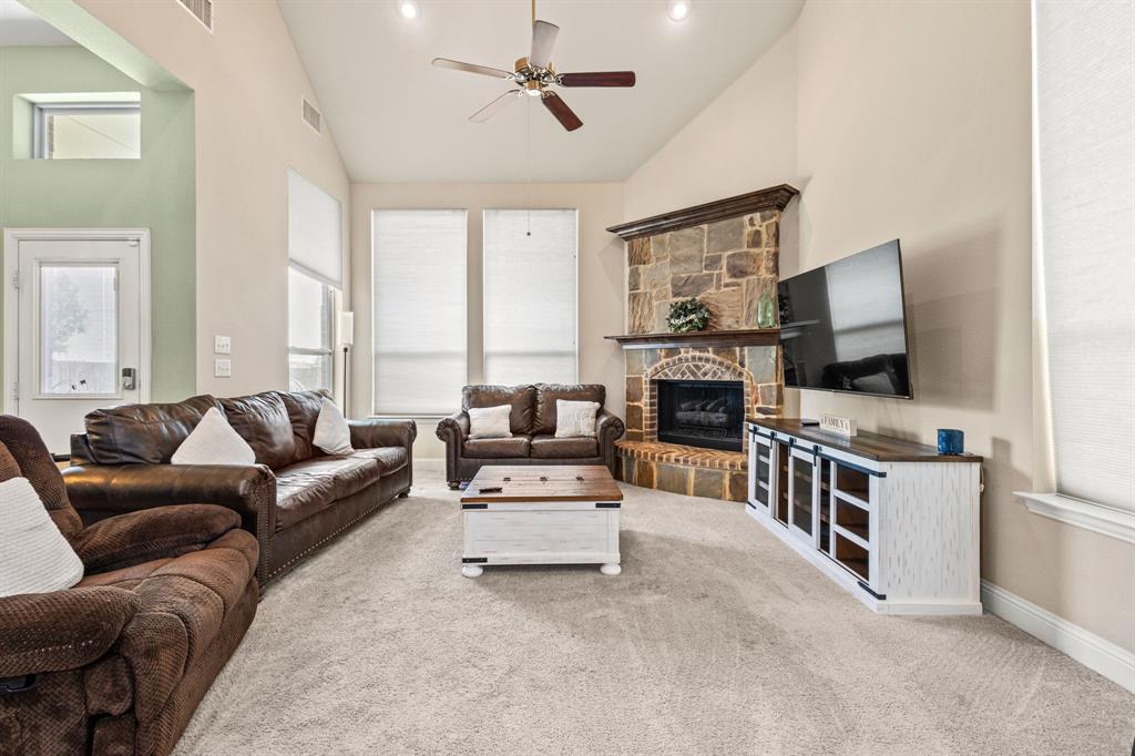 1036 Edgefield Lane Forney, TX 75126 - Photo 18 of 30 a living room with furniture and a flat screen tv