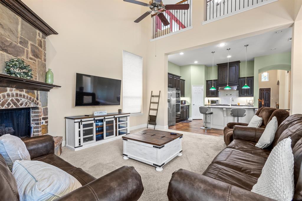 1036 Edgefield Lane Forney, TX 75126 - Photo 19 of 30 a living room with furniture and a flat screen tv