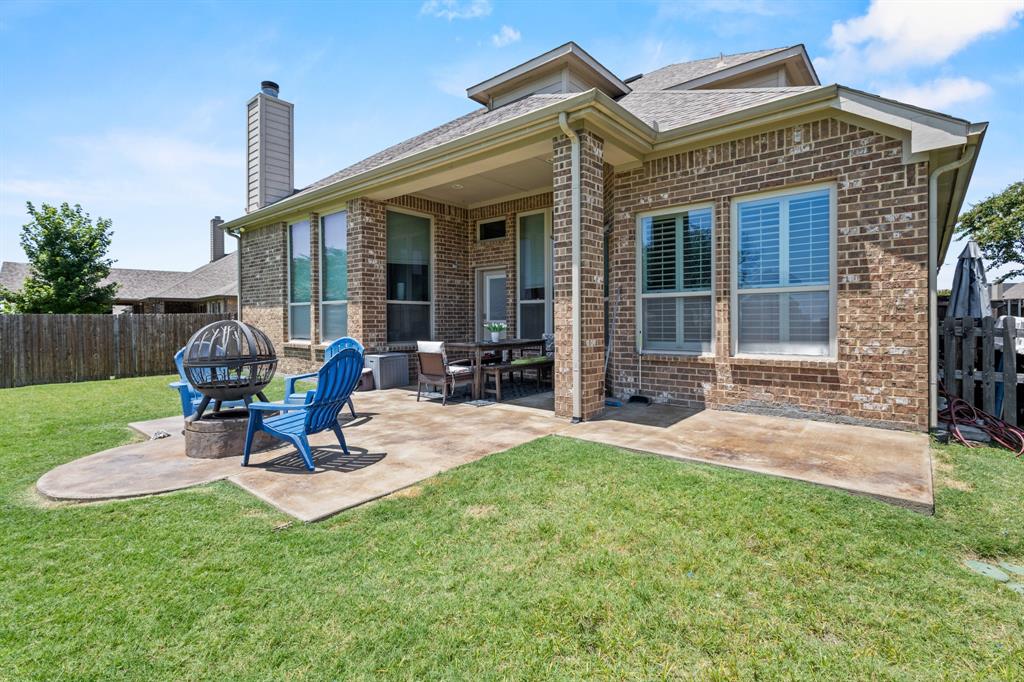 1036 Edgefield Lane Forney, TX 75126 - Photo 30 of 30 a view of a house with backyard porch and sitting area