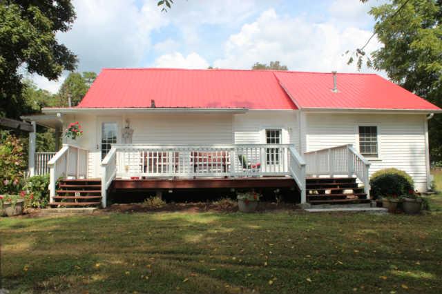 1490 Nails Creek Road Dickson, TN 37055 - Photo 2 of 11 a front view of a house with a garden and deck