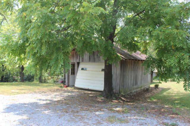 1490 Nails Creek Road Dickson, TN 37055 - Photo 3 of 11 a front view of a house with a yard