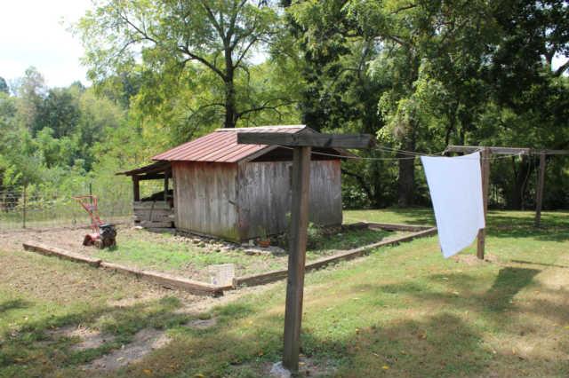 1490 Nails Creek Road Dickson, TN 37055 - Photo 4 of 11 a backyard of a house with barbeque oven