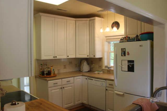 1490 Nails Creek Road Dickson, TN 37055 - Photo 5 of 11 a kitchen with stainless steel appliances a refrigerator sink and cabinets