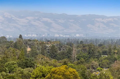 a view of a city with mountains in the background