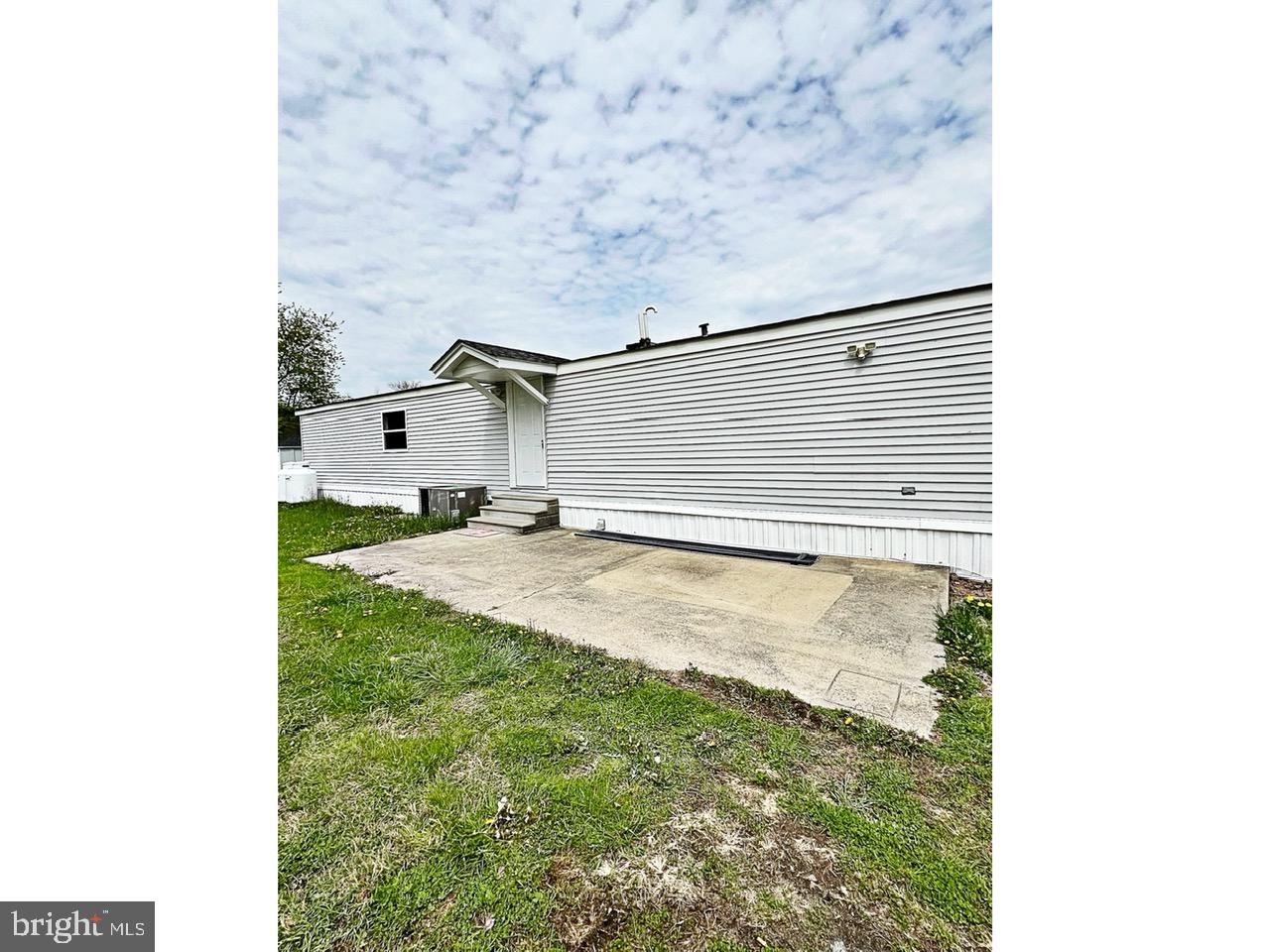 2189 Downs Chapel Road Clayton, DE 19938 - Photo 2 of 13 a bathroom with a sink and a window