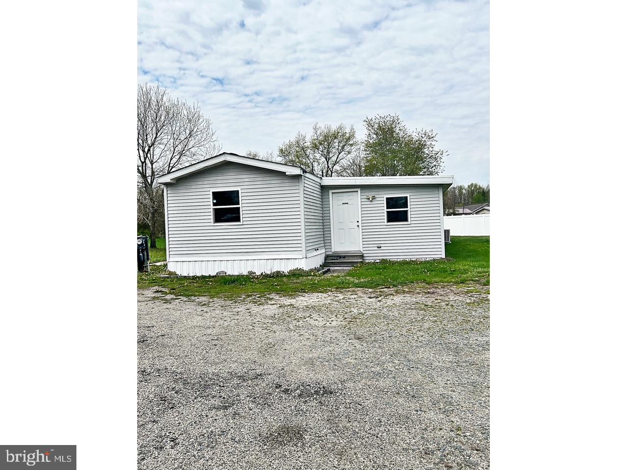 2189 Downs Chapel Road Clayton, DE 19938 - Photo 7 of 13 a bathroom with a sink and mirror