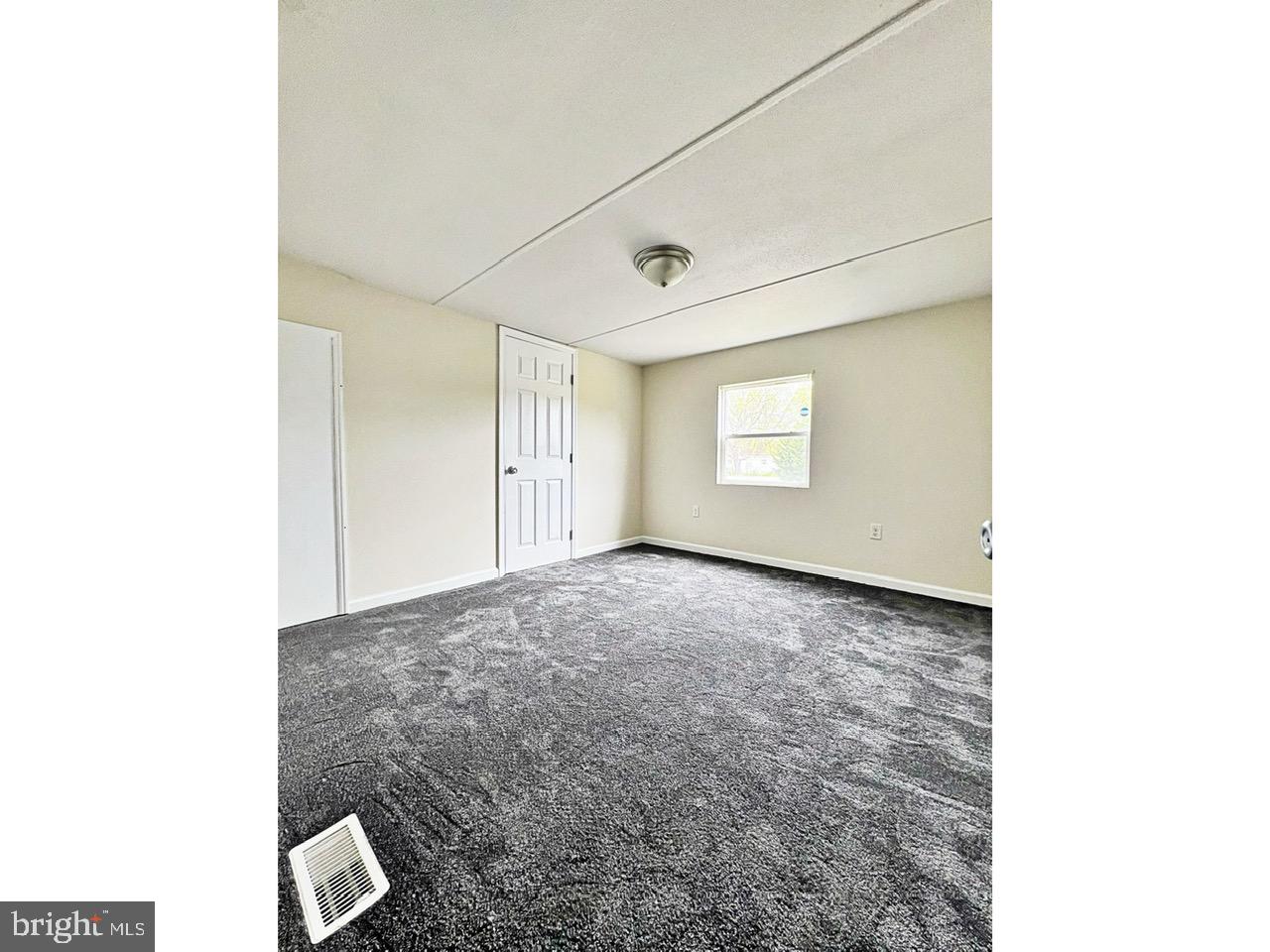 2189 Downs Chapel Road Clayton, DE 19938 - Photo 8 of 13 a view of an empty room with a window