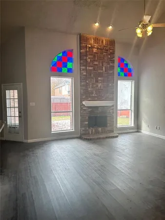 a view of an entryway with wooden floor