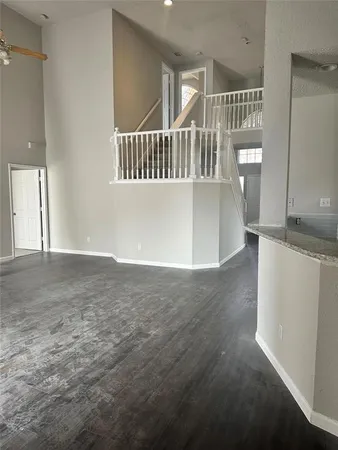 a view of an empty room with stairs