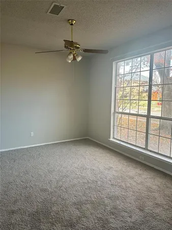 an empty room with a empty space and a window