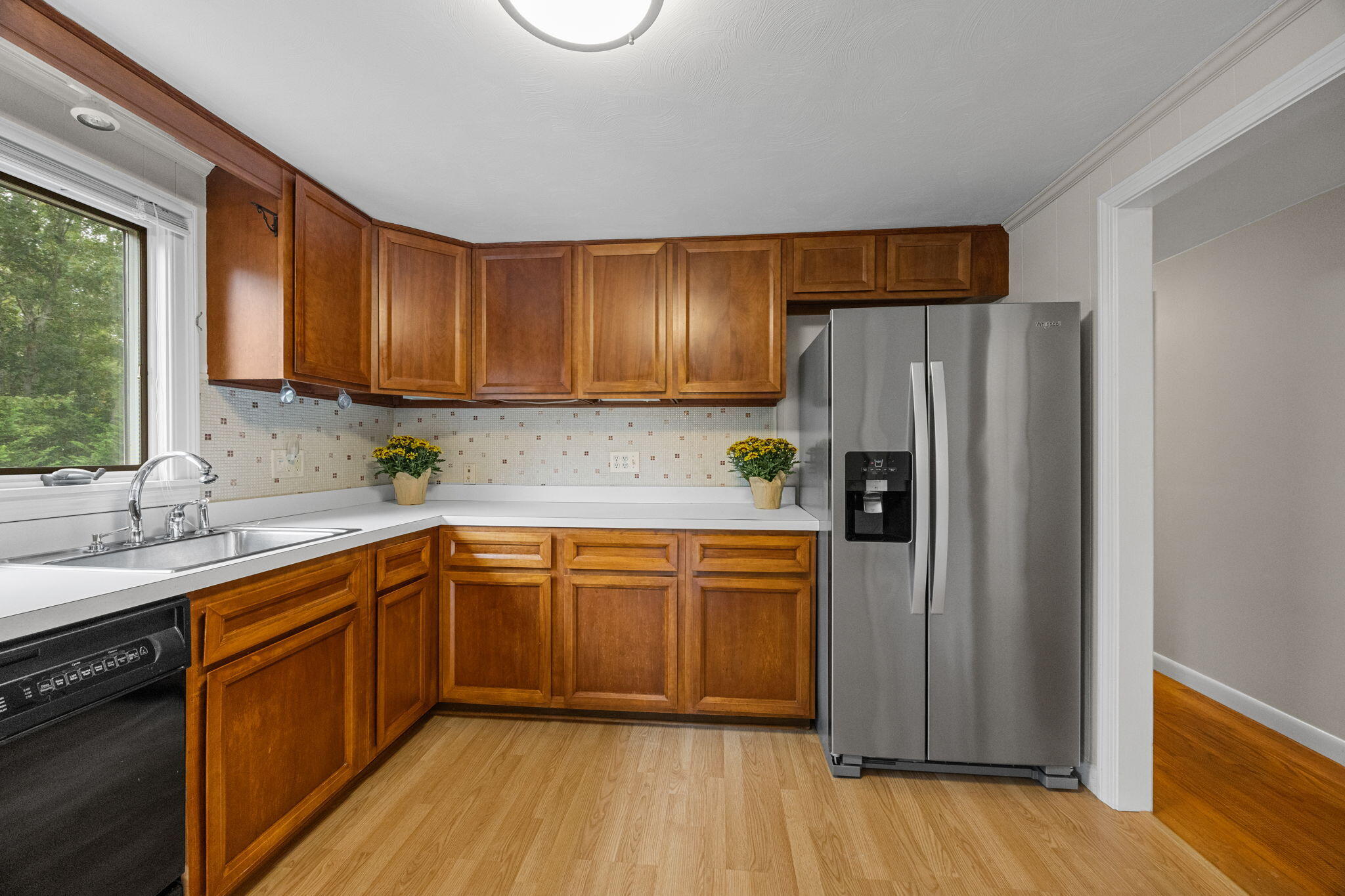 21 Green Way South Yarmouth, MA 02664 - Photo 15 of 42 a kitchen with stainless steel appliances granite countertop a refrigerator a sink dishwasher and wooden cabinets with wooden floor