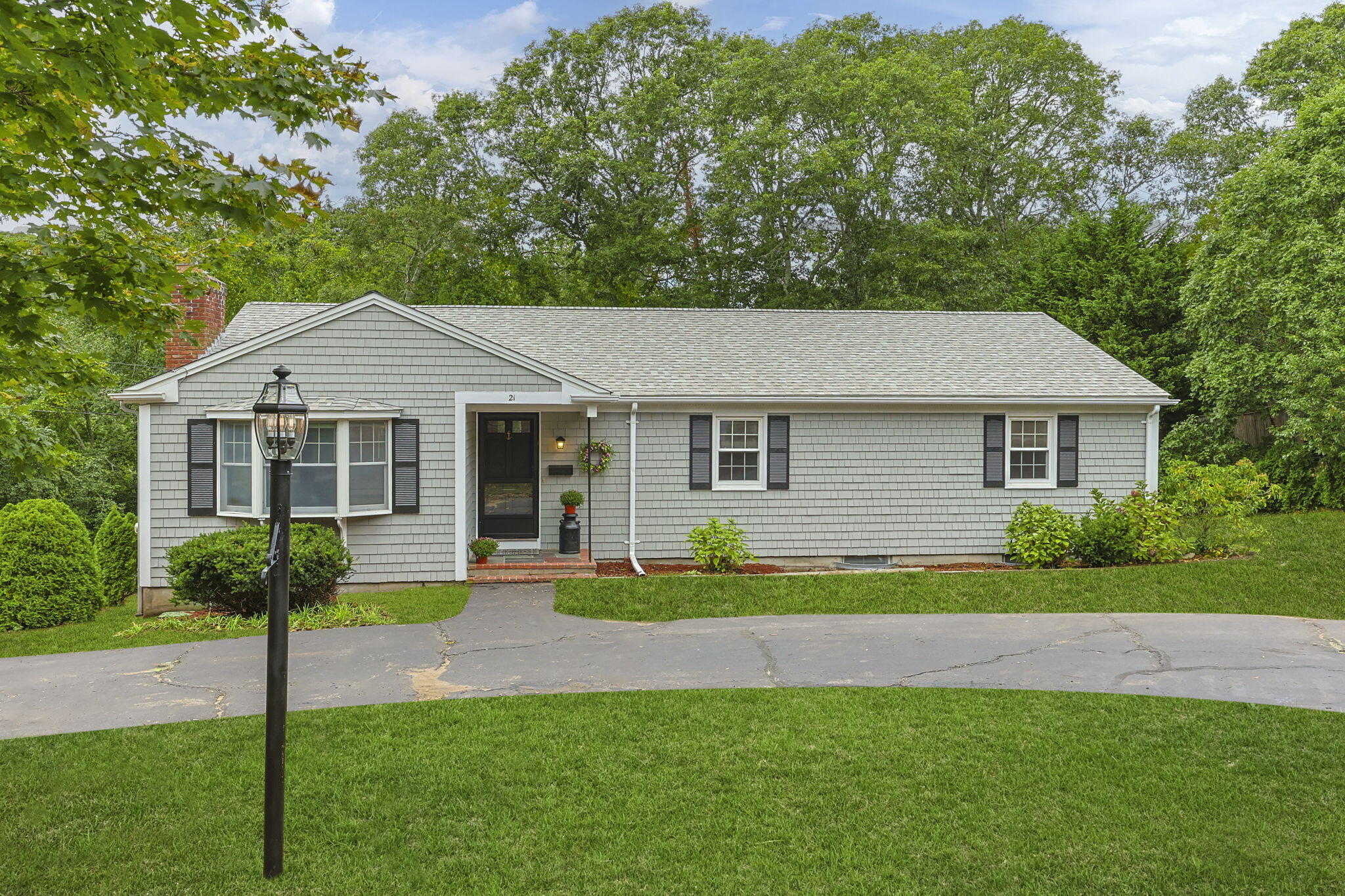 21 Green Way South Yarmouth, MA 02664 - Photo 2 of 42 a front view of a house with a yard and porch