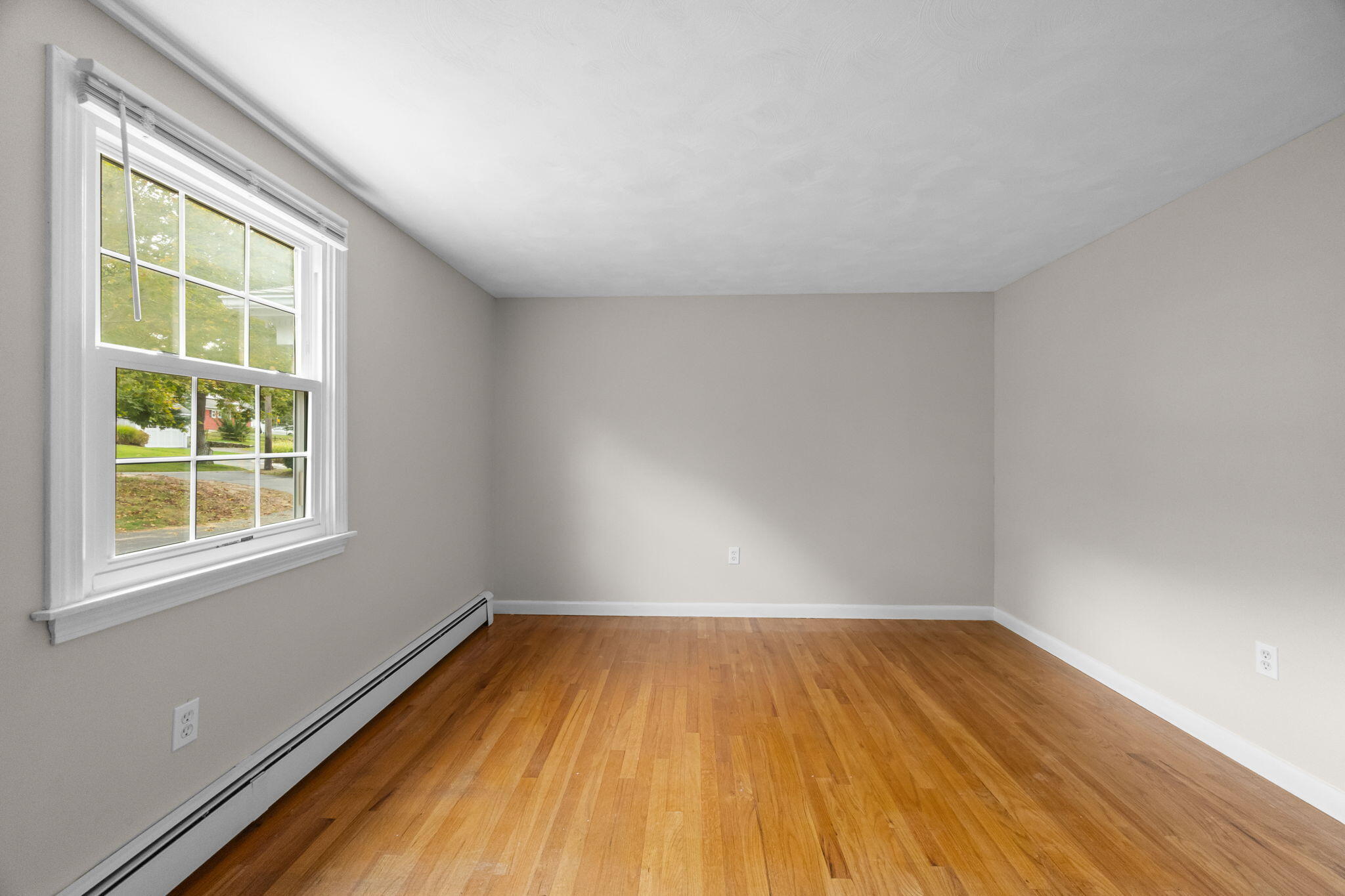 21 Green Way South Yarmouth, MA 02664 - Photo 24 of 42 an empty room with wooden floor and windows