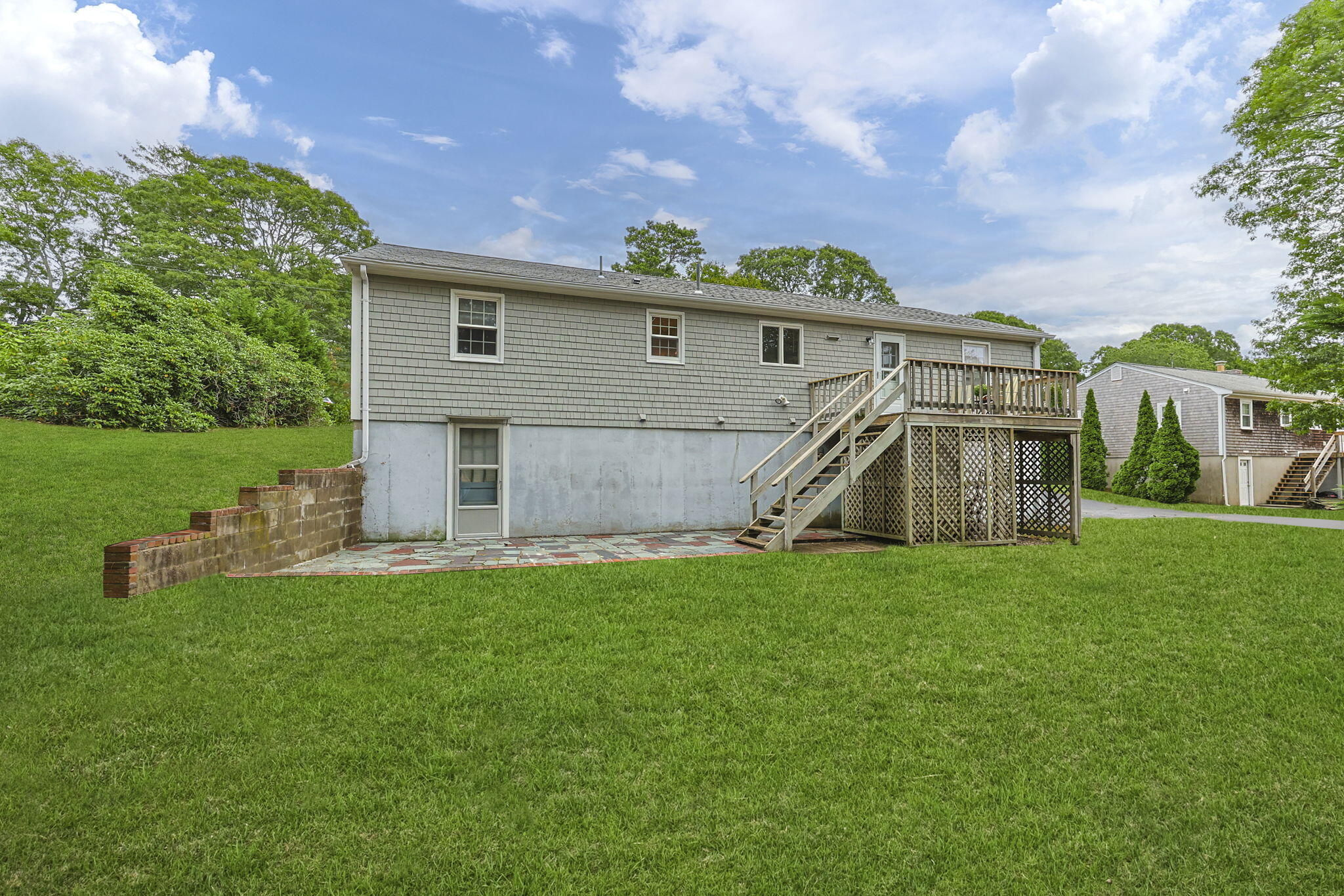 21 Green Way South Yarmouth, MA 02664 - Photo 29 of 42 a view of a house with a yard and sitting area
