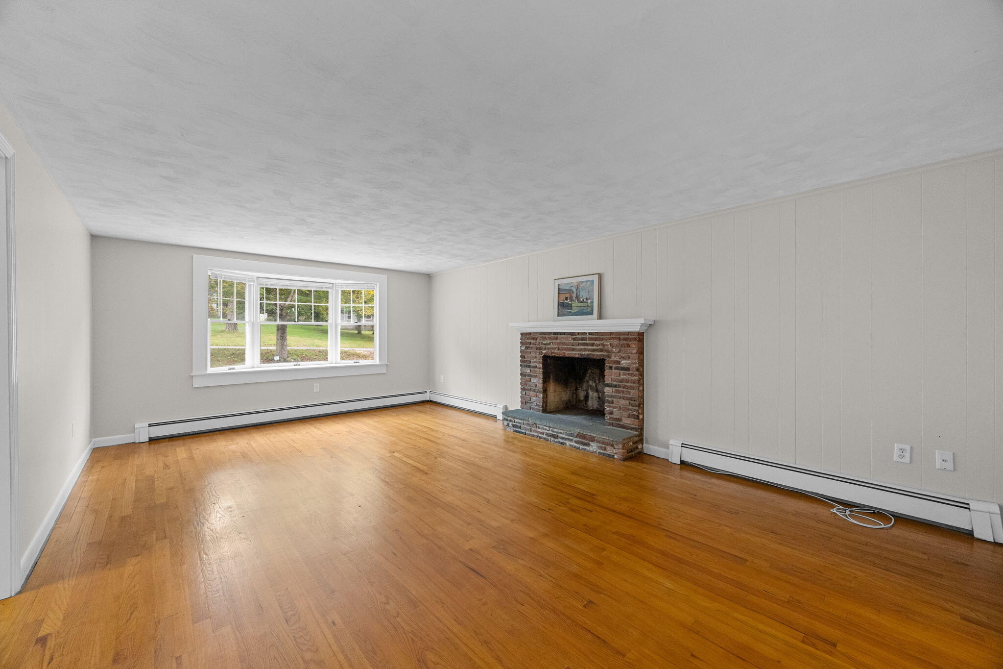 21 Green Way South Yarmouth, MA 02664 - Photo 8 of 42 a view of an empty room with wooden floor and a window
