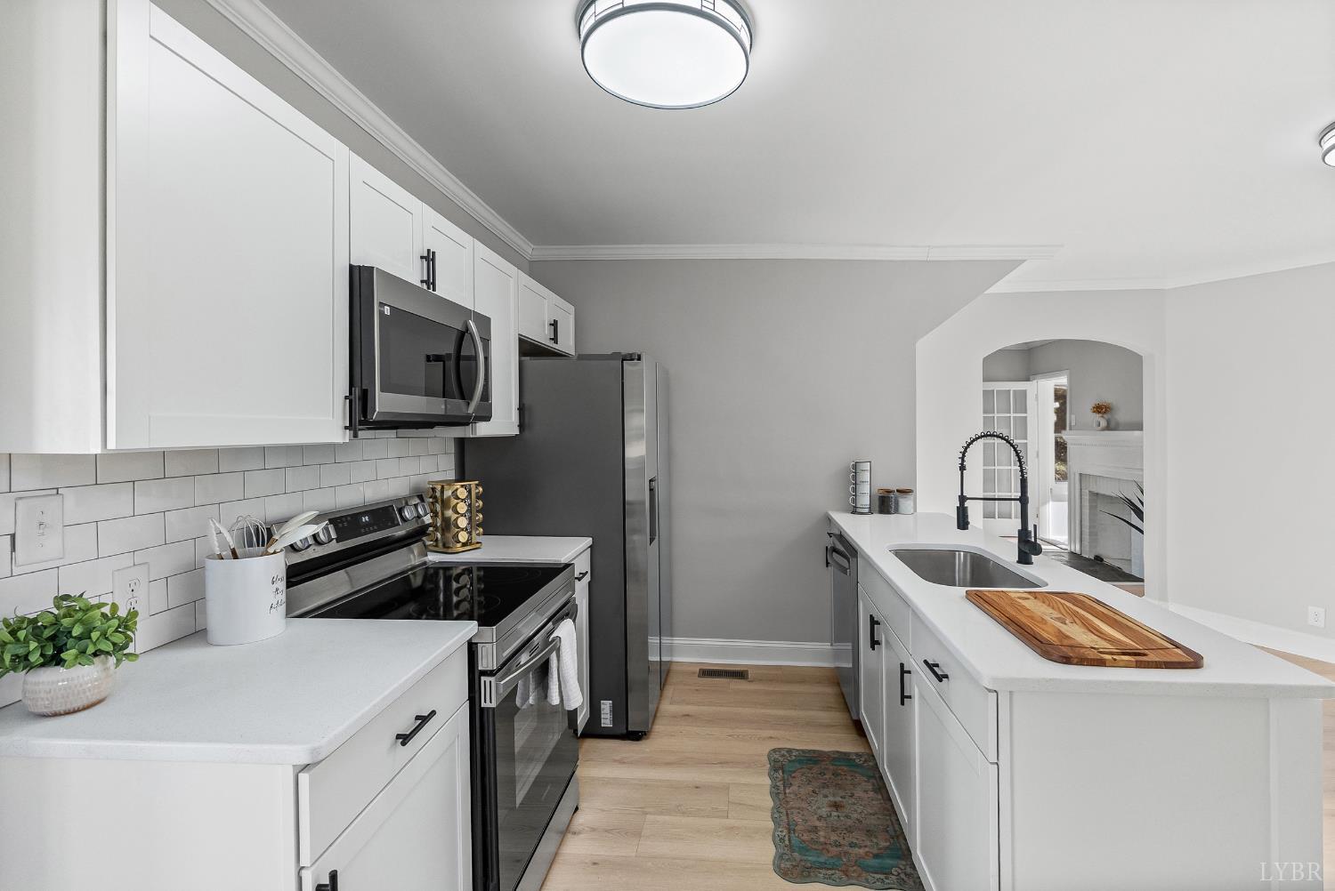 1612 South Amherst Highway Amherst, VA 24521 - Photo 3 of 48 a kitchen with a sink a stove and refrigerator