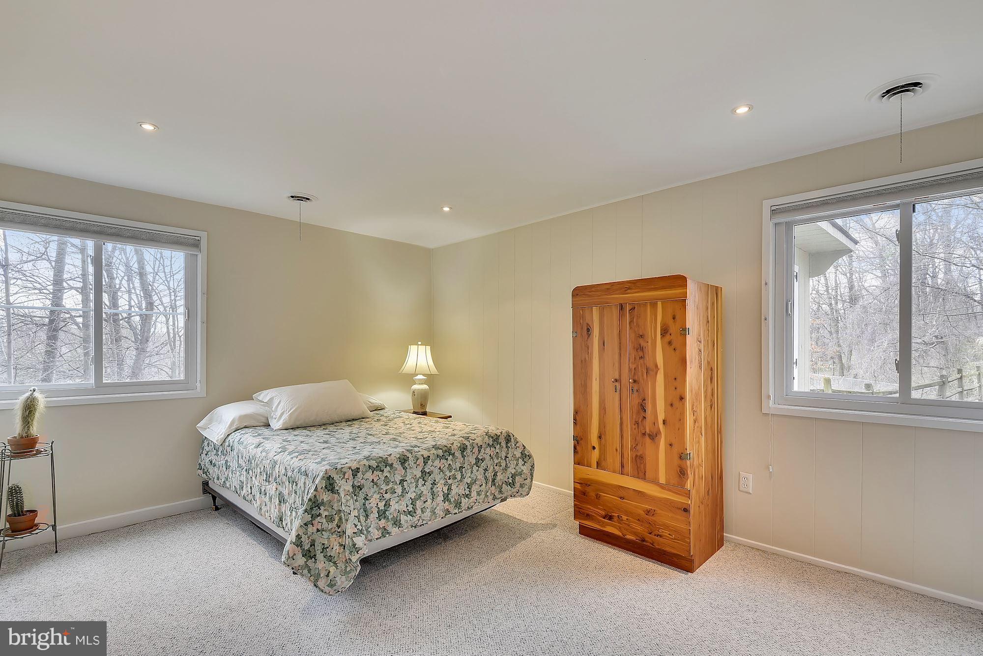 7600 Hamilton Spring Road Bethesda, MD 20817 - Photo 11 of 24 a bedroom with a bed and a window